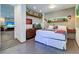 Bright bedroom with a large bed, built-in shelving, and aquarium feature at 1560 53Rd N St, St Petersburg, FL 33710