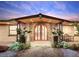 Inviting front entrance with stone accents and a double wooden door at 1560 53Rd N St, St Petersburg, FL 33710