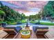 Serene backyard with deck, water feature, and sunset view at 1560 53Rd N St, St Petersburg, FL 33710