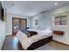Bright bedroom with a king-size bed, tiled floors, and access to a patio at 1560 53Rd N St, St Petersburg, FL 33710