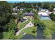 Aerial view of home, pool, and lakefront property at 1560 53Rd N St, St Petersburg, FL 33710