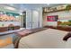 Modern bedroom with large bed, built-in shelving, and aquarium at 1560 53Rd N St, St Petersburg, FL 33710