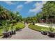 Landscaped backyard oasis with a fire pit and pond view at 1560 53Rd N St, St Petersburg, FL 33710