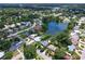Wide aerial view of neighborhood and lake at 1560 53Rd N St, St Petersburg, FL 33710