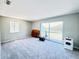 Spacious bedroom with carpet and access to balcony at 1960 Union St # 25, Clearwater, FL 33763