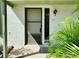 Simple house entrance with brown door and small porch at 1960 Union St # 25, Clearwater, FL 33763