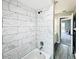 Bathroom with marble tile shower/tub combo at 1960 Union St # 25, Clearwater, FL 33763