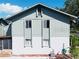 Rear view of a two-story house with green exterior at 1960 Union St # 25, Clearwater, FL 33763