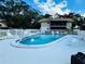 Community pool with lounge chairs at 1960 Union St # 25, Clearwater, FL 33763