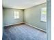 Bedroom with neutral walls, carpet, and window at 1960 Union St # 25, Clearwater, FL 33763