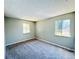 Bedroom with neutral walls, carpet, and window at 1960 Union St # 25, Clearwater, FL 33763