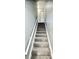 Indoor staircase with carpeted steps and neutral walls at 1960 Union St # 25, Clearwater, FL 33763