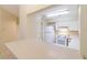 Galley style kitchen with white cabinets and appliances at 2333 Feather Sound Dr # B101, Clearwater, FL 33762