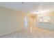 Spacious living area with view of kitchen and hallway at 2333 Feather Sound Dr # B101, Clearwater, FL 33762