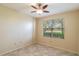 Well-lit bedroom with tile flooring and a ceiling fan at 2333 Feather Sound Dr # B101, Clearwater, FL 33762