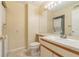Clean bathroom with a vanity, toilet and stackable washer/dryer at 2333 Feather Sound Dr # B101, Clearwater, FL 33762