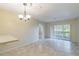 Bright living room with tile floors and sliding glass doors at 2333 Feather Sound Dr # B101, Clearwater, FL 33762