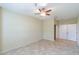 Spacious bedroom with tile floors and ceiling fan at 2333 Feather Sound Dr # B101, Clearwater, FL 33762