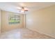 Bright bedroom with tile flooring and a ceiling fan at 2333 Feather Sound Dr # B101, Clearwater, FL 33762