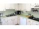 Kitchen with stainless steel appliances and white cabinets at 2351 Irish Ln # 23, Clearwater, FL 33763