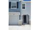 A charming two-story townhome showcasing a well-maintained facade with a garage and front door at 2472 Mellow Ln, Clearwater, FL 33765