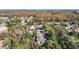 Aerial view of a house nestled in a wooded neighborhood, showcasing its location and surroundings at 364 Terrace Rd, Tarpon Springs, FL 34689