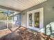 Bright screened porch with access from the home at 364 Terrace Rd, Tarpon Springs, FL 34689