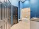Bathroom with blue walls, tub and vanity at 364 Terrace Rd, Tarpon Springs, FL 34689
