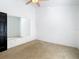 Bedroom with mirror, carpet and ceiling fan at 364 Terrace Rd, Tarpon Springs, FL 34689