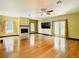 Bright living room with hardwood floors, fireplace, and sliding glass doors at 364 Terrace Rd, Tarpon Springs, FL 34689
