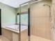 Bathroom with a walk-in shower and a large soaking tub at 364 Terrace Rd, Tarpon Springs, FL 34689