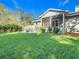 Large backyard, screened porch, fire pit at 364 Terrace Rd, Tarpon Springs, FL 34689