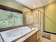Bathroom with a large soaking tub and a walk-in shower at 364 Terrace Rd, Tarpon Springs, FL 34689