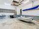 Garage with storage cabinets, kayaks, and inflatable boat at 364 Terrace Rd, Tarpon Springs, FL 34689