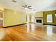 Bright living room with hardwood floors, fireplace, and sliding glass doors at 364 Terrace Rd, Tarpon Springs, FL 34689