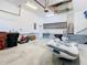 Garage with ample storage and a small boat at 364 Terrace Rd, Tarpon Springs, FL 34689