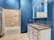 Updated bathroom with tub, shower, and granite vanity at 364 Terrace Rd, Tarpon Springs, FL 34689