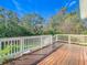 Wooden deck with white railing overlooking the backyard at 364 Terrace Rd, Tarpon Springs, FL 34689