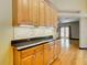 Kitchen features wood cabinets, granite counters and decorative tile at 364 Terrace Rd, Tarpon Springs, FL 34689