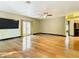 Bright living room with hardwood floors, fireplace, and sliding glass doors at 364 Terrace Rd, Tarpon Springs, FL 34689