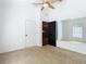 Bedroom with carpet, large mirror and ceiling fan at 364 Terrace Rd, Tarpon Springs, FL 34689