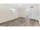 Bedroom with wood-look floors, access to bathroom and outside at 4220 Sheldon Pl # 4220, New Port Richey, FL 34652