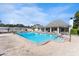 Inviting community pool with a spacious deck and shaded seating area at 4220 Sheldon Pl # 4220, New Port Richey, FL 34652