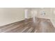 Open living area with wood-look floors and views into the kitchen at 4220 Sheldon Pl # 4220, New Port Richey, FL 34652