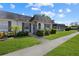 Front view of the house showing the walkway and lawn at 4220 Sheldon Pl # 4220, New Port Richey, FL 34652