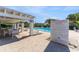 Community pool with lounge chairs and a covered patio area at 4220 Sheldon Pl # 4220, New Port Richey, FL 34652