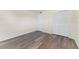 Bedroom with wood-look floors and a double door closet at 4220 Sheldon Pl # 4220, New Port Richey, FL 34652