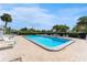 Inviting community swimming pool with plenty of lounge chairs at 4220 Sheldon Pl # 4220, New Port Richey, FL 34652