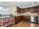 Modern kitchen with granite countertops and wood cabinets at 5200 Brittany S Dr # 1708, St Petersburg, FL 33715