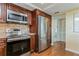 Modern kitchen with stainless steel appliances and wood cabinets at 5200 Brittany S Dr # 1708, St Petersburg, FL 33715